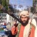 In this picture taken on August 13, 2021, a Taliban fighter holds a rocket-propelled grenade (RPG) along the roadside in Herat, Afghanistan's third biggest city, after government forces pulled out the day before following weeks of being under siege. (Photo by - / AFP)